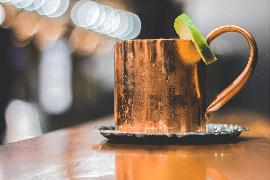 pumpkin pie moscow mule in a copper mug on a bartop